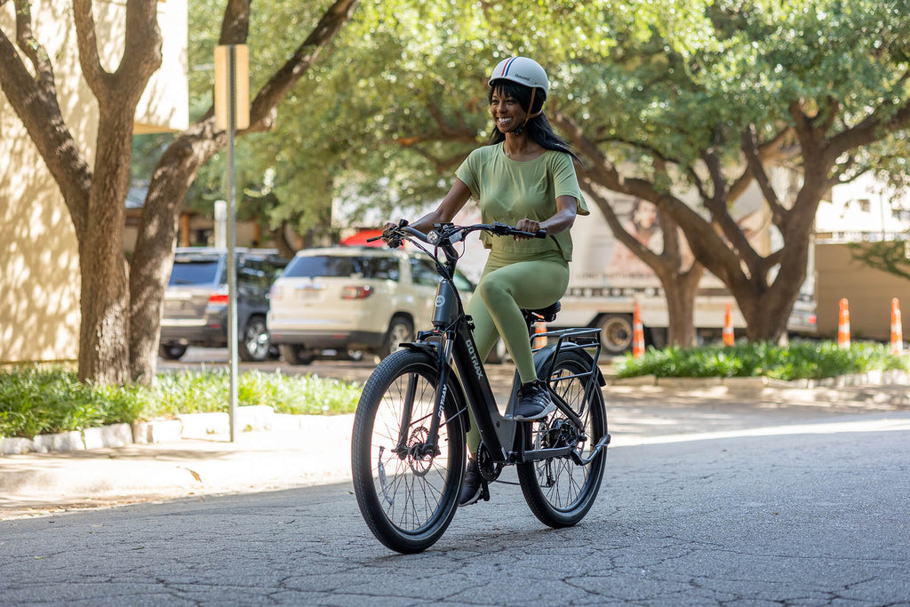 Woman riding the GOTRAX CTI 3 Step Thru City Electric Scooter